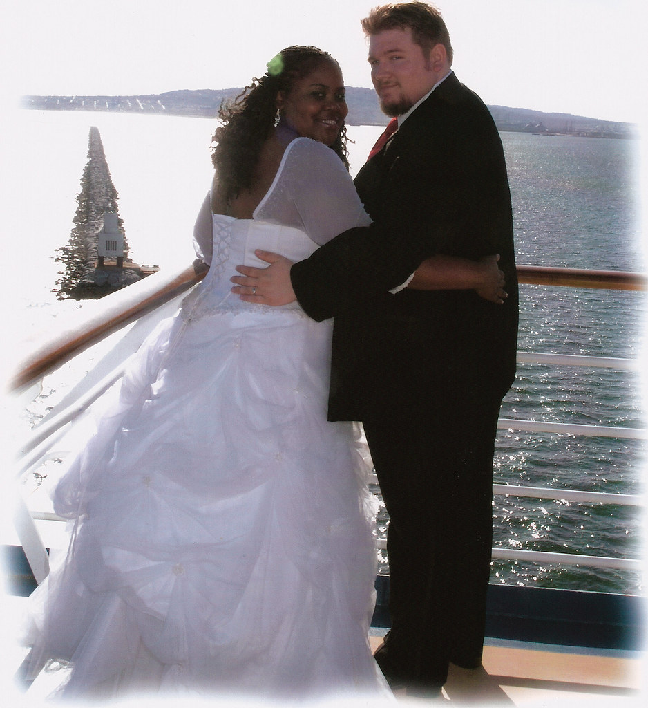 An interracial couple on their wedding day.
