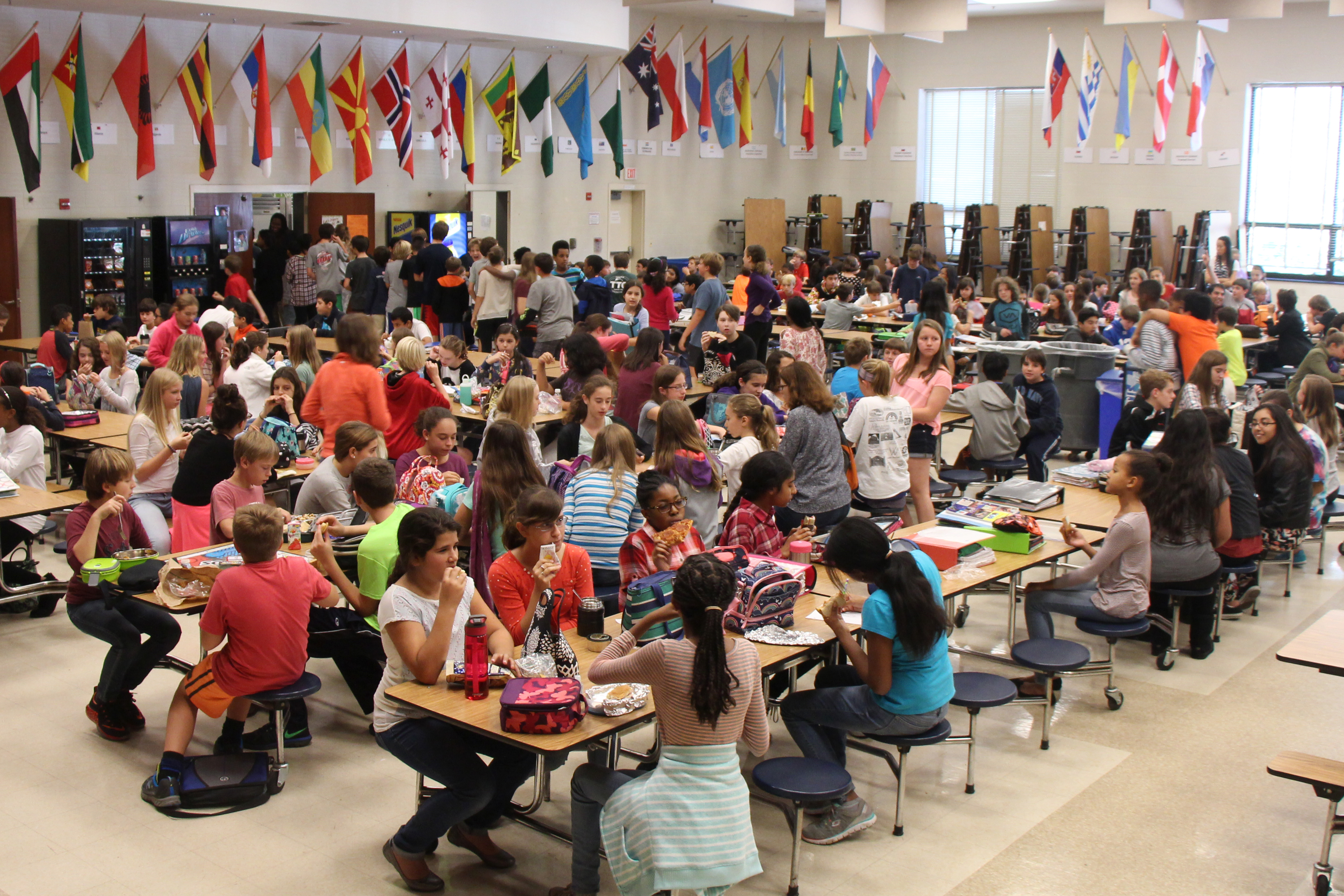 Large cafeteria lunch at a middle school.