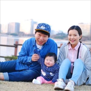 Young couple with their baby girl.