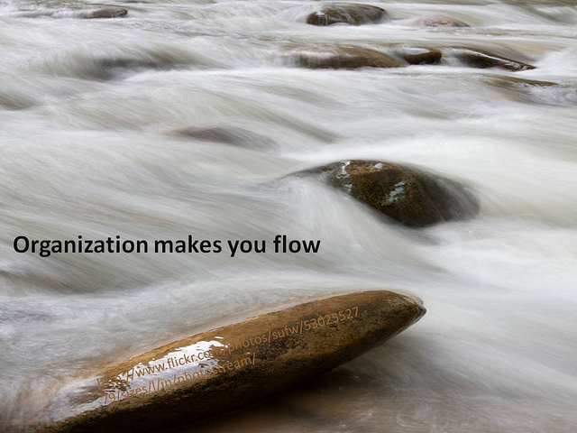 A motivational poster of water running over rocks. The caption says