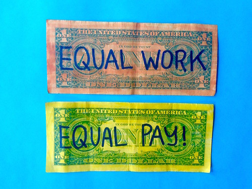 Artwork of dollar bills with the words Equal Pay for Equal Work on them
