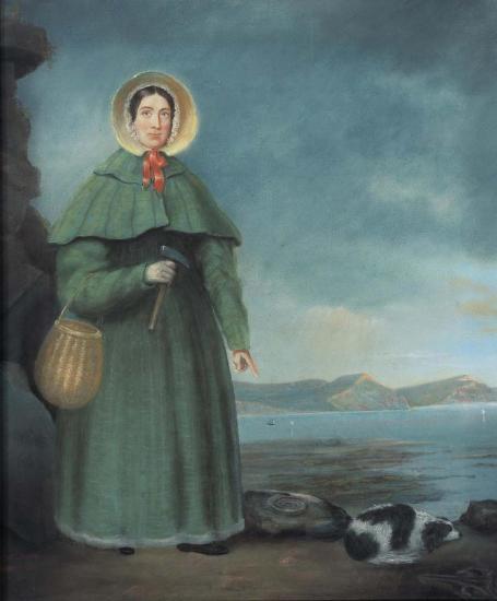  An oil painting of Mary Anning and her dog, Tray, prior to 1845. The “Jurassic Coast” of Lyme Regis is in the background. Notice that Anning is pointing at a fossil!