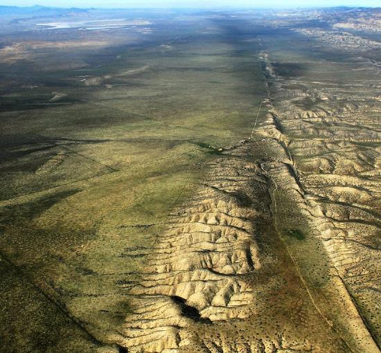 The landscape of the San Andreas Fault is scarred by the movement of tectonic plates during earthquakes.