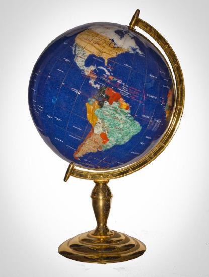  The classroom globe reflecting planet Earth as a perfect sphere with an axis that bisects the points known as Geographic North and Geographic South.