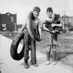 Boys collecting old tires for rubber during WWII.