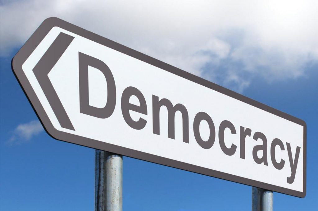 Democracy Road Sign