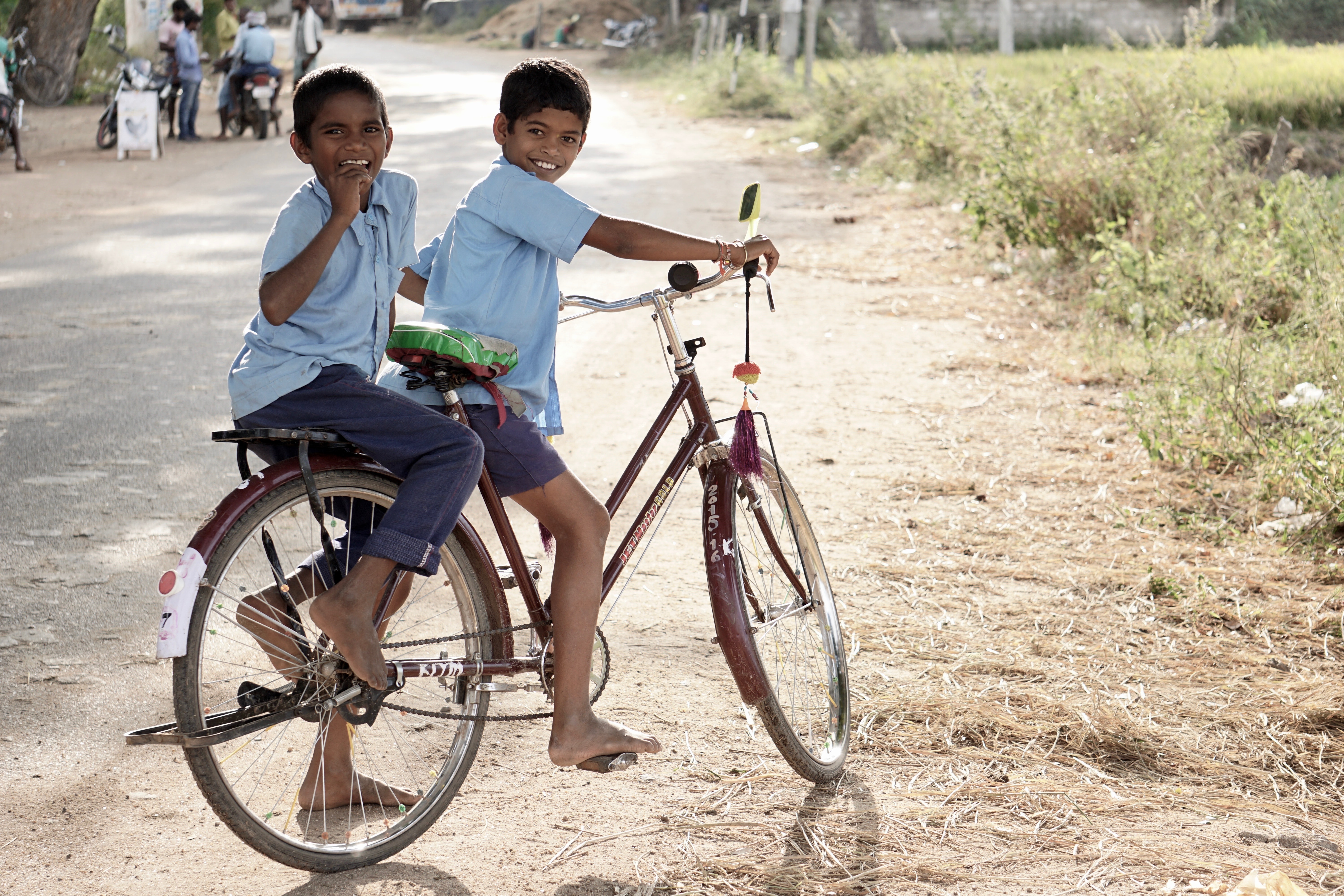 Two boys on a bike.