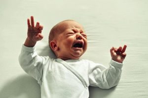 photo of an infant boy crying
