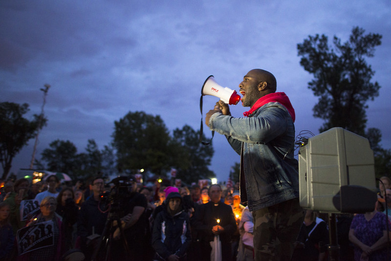 Speaker at a vigil for Charlottesville