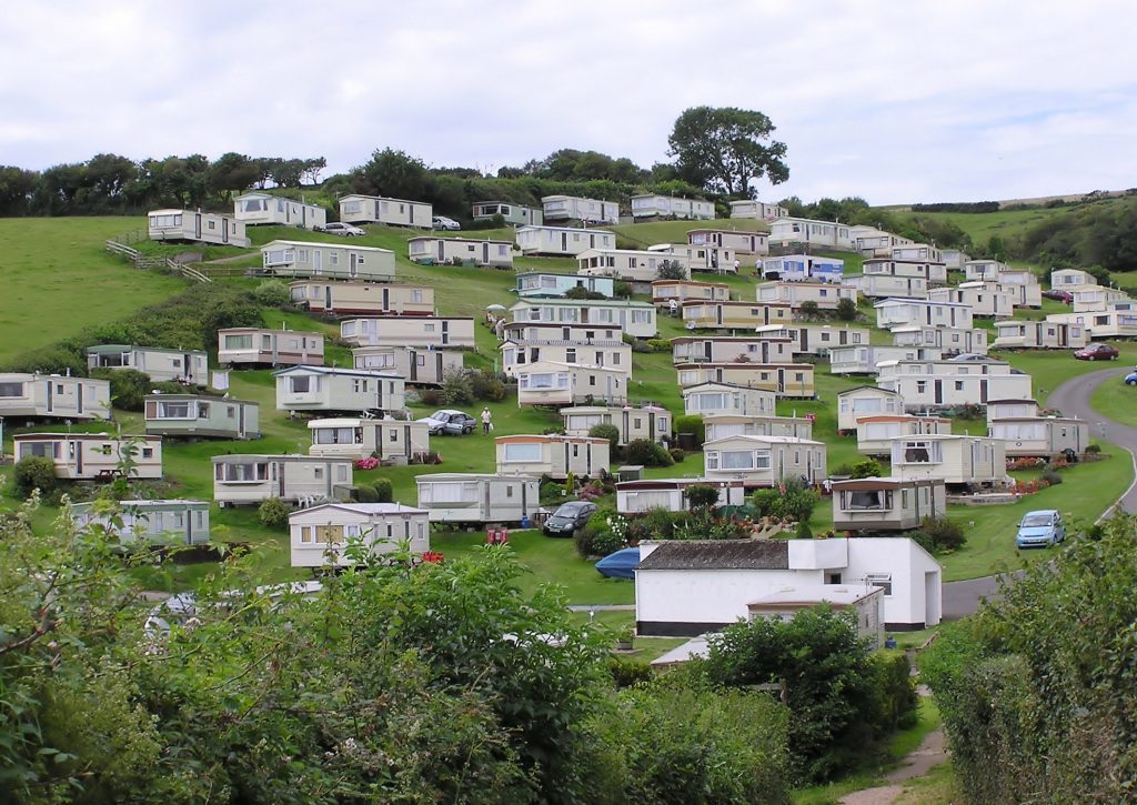 Photograph of hillside covered with mobile homes.