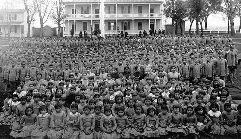 Group photo of the students at the Carlisle Boarding School.