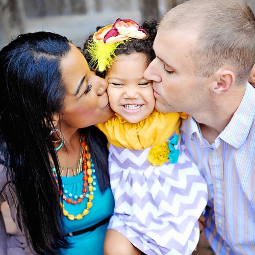 Interracial married couple and child.