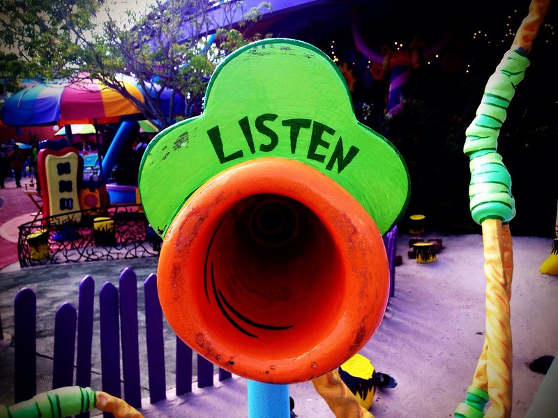 Children's playground toy that says "Listen"
