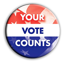 Political button with Your Vote Counts over parts of a U.S. flag