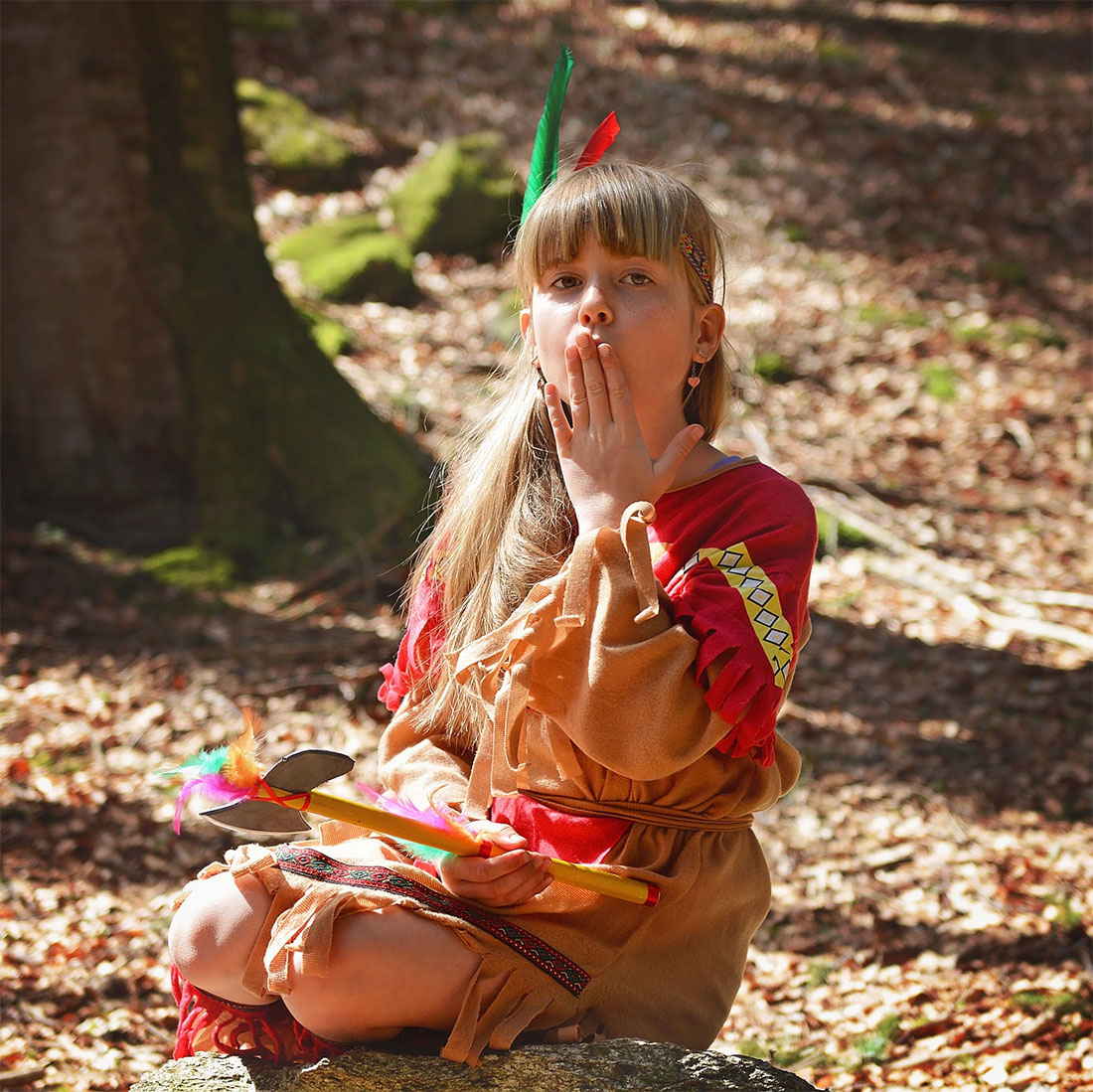 Child in a costume depicting a native American.