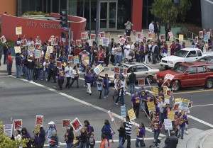 Janitors are shown protesting in Santa Monica.