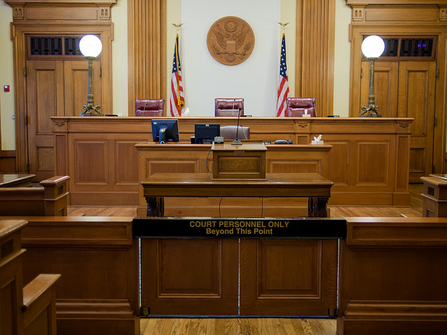 interior of a courtroom facing the judge's bench
