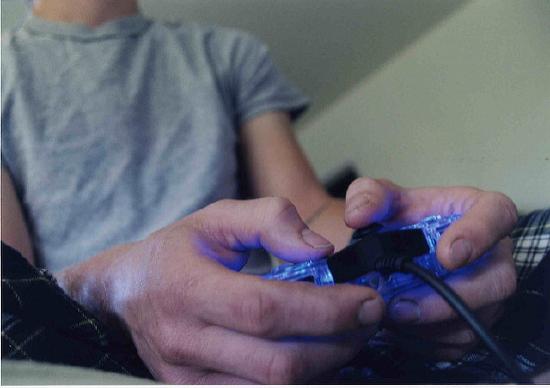 a person holds a video game controller