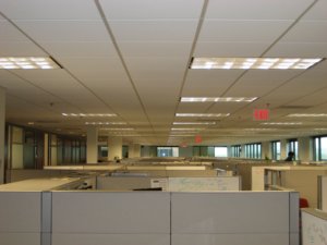 The image shown is of various office cubicles. Cubicles are used to maximize individual workspace in an office. Such structures may be rational, but they are also isolating.
