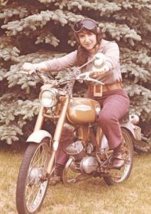 Nancy Caroline sitting on motorcycle