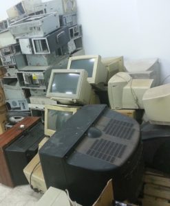 A large pile of outdated computer equipment