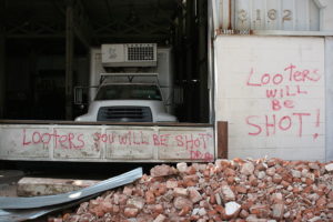 A sign warns looters they will be shot