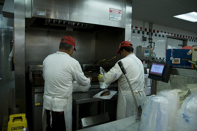 Restaurant workers making food.