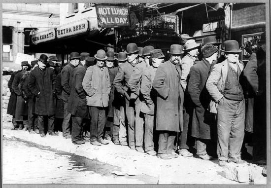 Bowery men waiting for bread in bread line in New York City