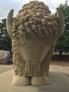 Picture of Reconciliation Park where a Limestone buffalo symbolizing the spiritual survival of the Dakota people.