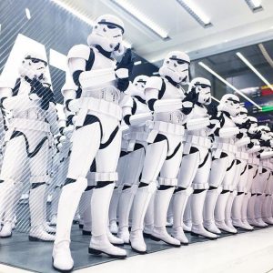A line of identically dressed Storm Troopers from the Star Wars films.