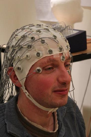 Man wearing EEG cap.