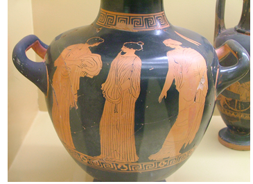 An ancient Greek water vessel depicting the figures of three women.