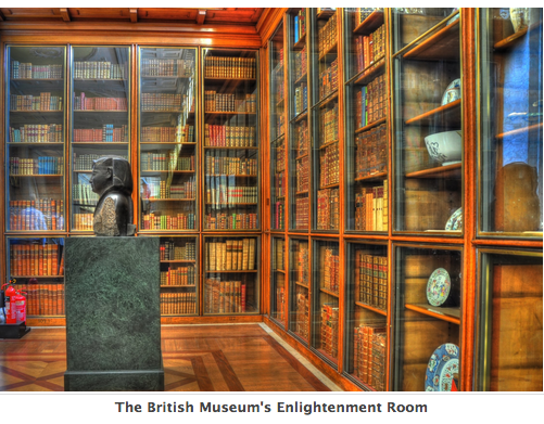Photograph of the Enlightenment Room of the British Museum, showing walls lined with bookshelves and an Egyptian statue on a pedestal at the center of the room.