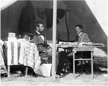 Photograph of President Lincoln and General McClellan in the general's tent at Antietam, Maryland, 1862.
