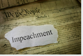 Photograph of the front page of the Constitution, with an image of a torn piece of paper printed with the word "Impeachment" edited on top.