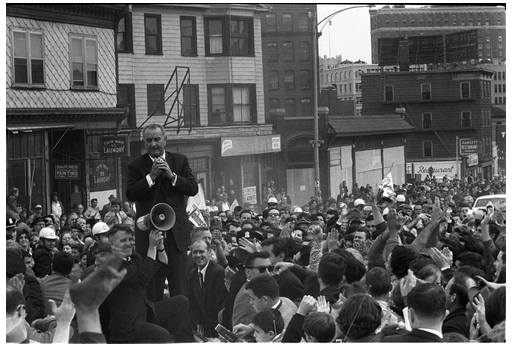 Photograph of President Lyndon B. Johnson addressing a crowd at a campaign rally.