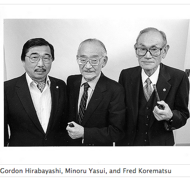 Black-and-white photograph of Gordon Hirabayashi, Minoru Yasui, and Fred Korematsu, from left to right.