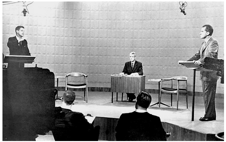 A black-and-white screen capture of the first televised debate between Presidential candidates, showing John F. Kennedy and Richard Nixon.