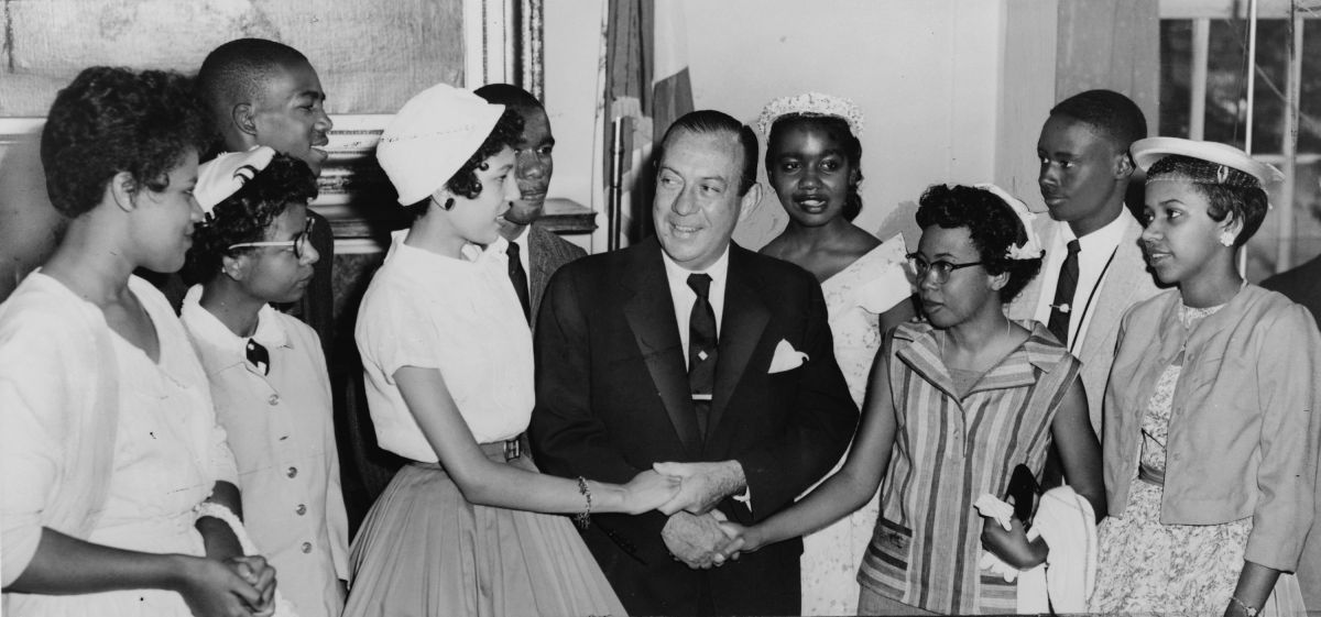 Black-and-white photograph of New York City Mayor Robert Wagner greeting the Little Rock Nine, the teenagers who integrated Central High School, Little Rock, Arkansas.