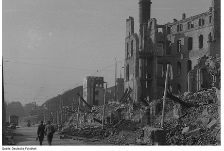 Black-and-white photograph of a bombed-out street in Dresden, Germany, taken in 1945 by Roger and Renate Rössing.