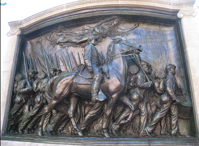 Photograph of the Memorial to Robert Gould Shaw and the 54th Massachusetts Volunteer Infantry Regiment, located on Boston Common, Boston, Massachusetts. Memorial consists of a brass sculptural panel depicting African American soldiers marching to war, set into a white marble structure.