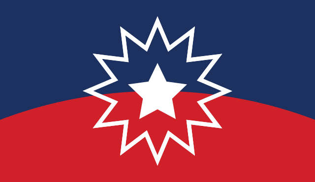 Graphic of the Juneteenth Flag, consisting of a background of dark blue at the top and red at the bottom, separated by a single curved line, and a centered white outline of a 12-pointed star surrounding a solid white 5-pointed star.