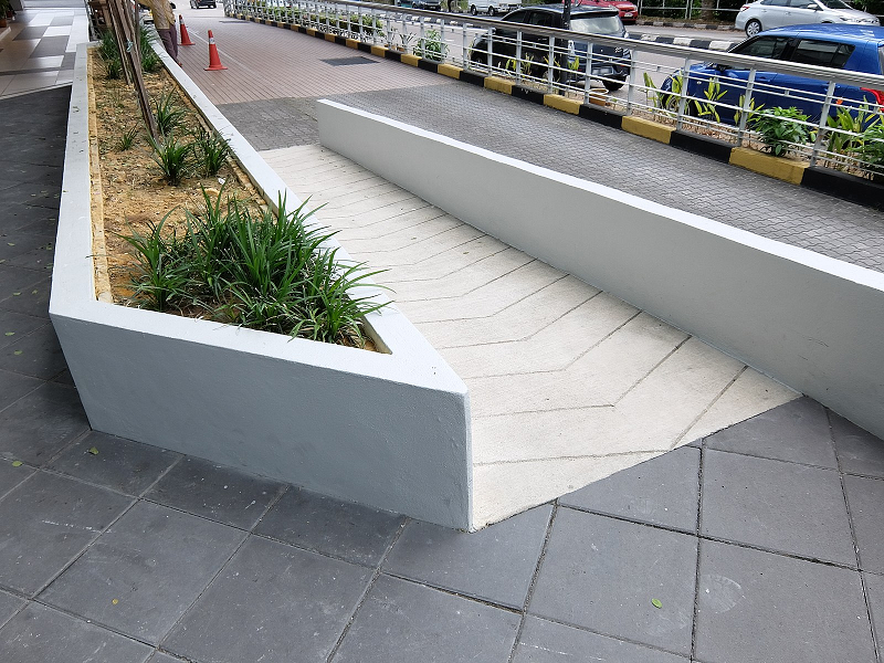 Photograph of a wheelchair ramp leading from the street into the building at Pelangi Tower, Johor Bahru, Johor, Malaysia