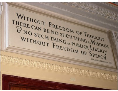 Photograph of a plaque depicting a 1792 quote from Benjamin Franklin, "Without freedom of thought there can be no such thing as wisdom and no such thing as publick liberty without freedom of speech".