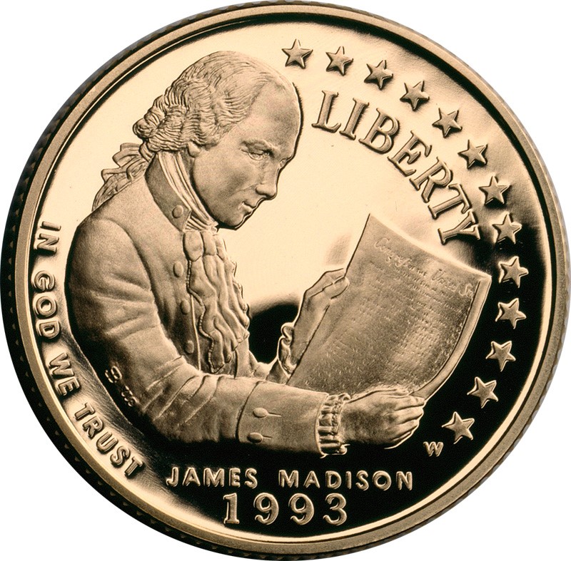 Face of a 1993 commemorative $5 gold coin, showing James Madison holding a document with the title "Congress of the United States."