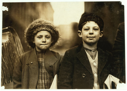 Black-and-white photograph by Lewis W. Hine, taken in 1909, showing an 8-year-old girl and a 10-year-old boy selling newspapers in Newark, New Jersey.