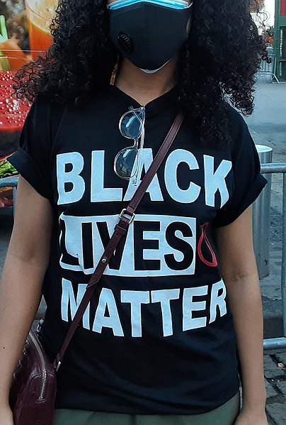 Photograph of a woman in New York City wearing a Black Lives Matter shirt, taken on June 14, 2020.