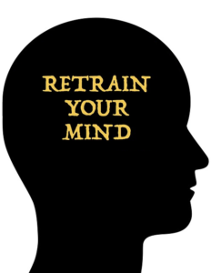 silhouette of a person's head with the words "Retrain your mind"