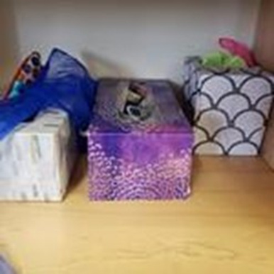 Tissues boxes used as toy storage.