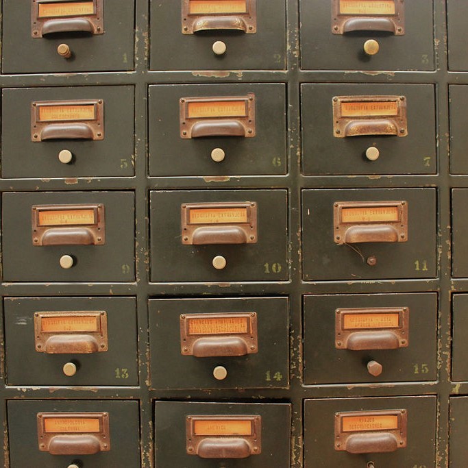 A series of numbered file drawers like those that were common in libraries.